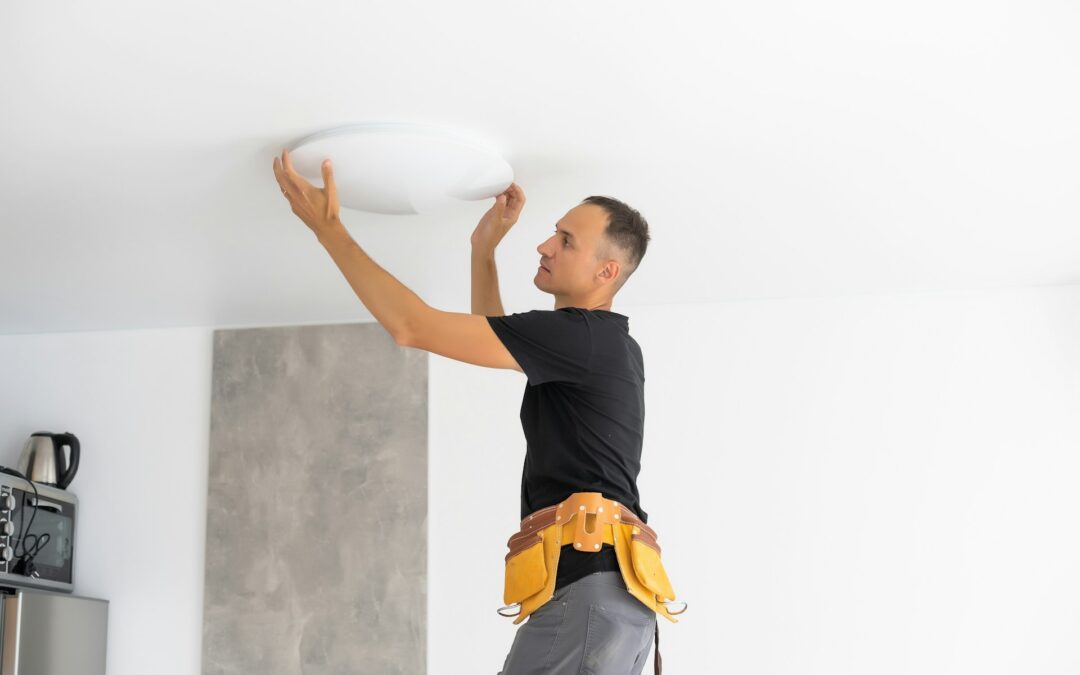 electrician fixing light